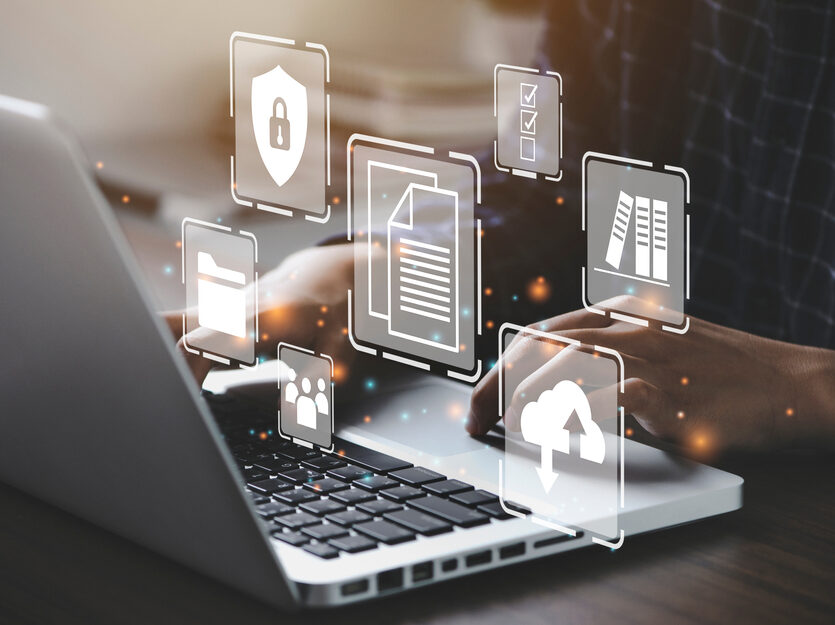 Businessman,Using,A,Computer,To,Document,Management,Concept,,Online,Documentation